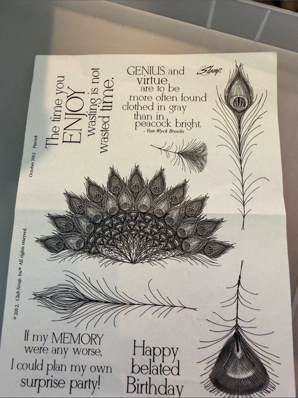 Set of 7  Peacock Feather and Script Stamps in a plastic binder by Club scrap